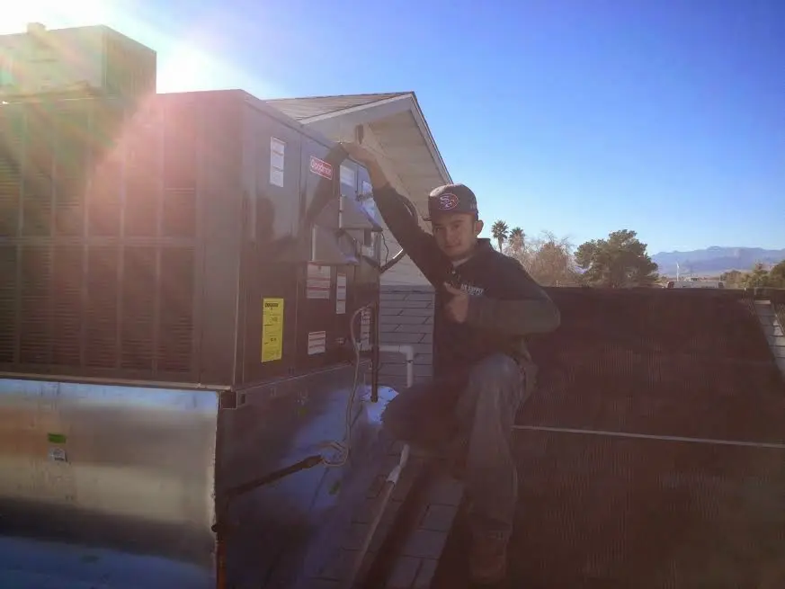 HVAC technician performing HVAC Inspection on a rooftop unit in Steele Creek